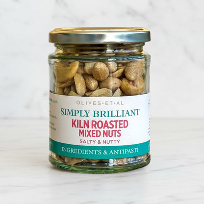 Jar of kiln roasted mixed nuts with a label on a white background