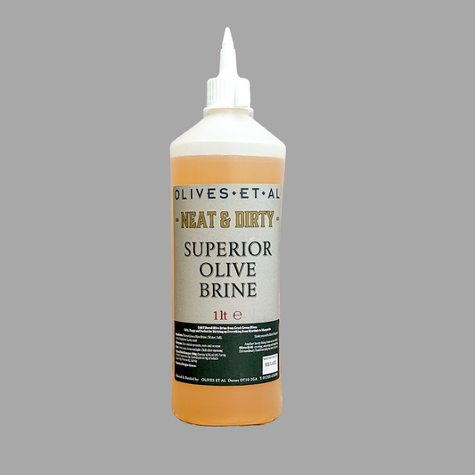Bottle of Olives Et Al Superior Olive Brine on a gray background