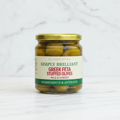 Jar of Greek Feta Stuffed Olives with a gold lid on a white background