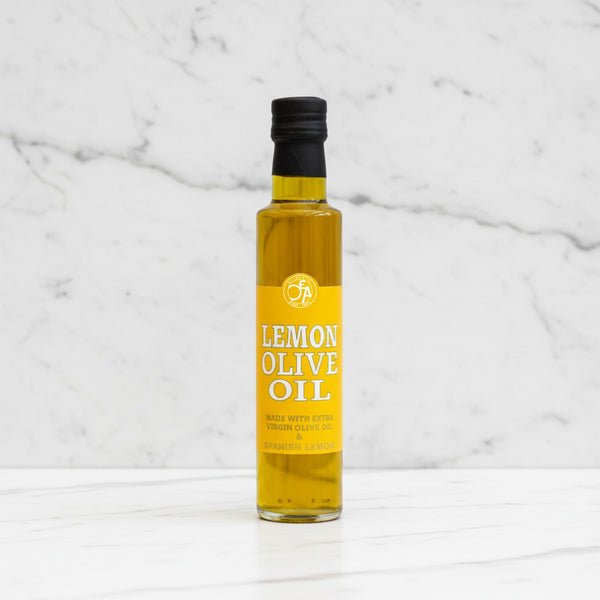 Bottle of lemon olive oil on a marble background