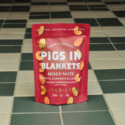 Packaged pigs in blankets nuts on a tiled floor