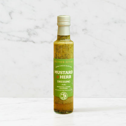 Bottle of mustard herb dressing on a marble background