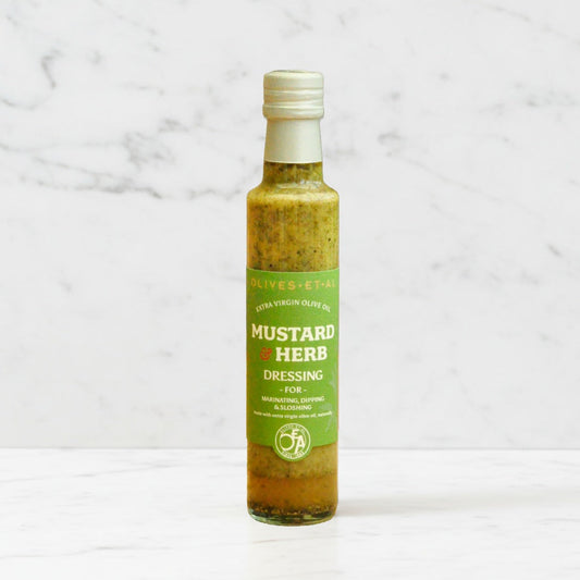 Bottle of mustard herb dressing on a marble background